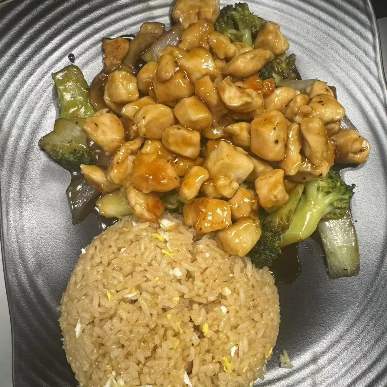 Teriyaki chicken stir fry with broccoli, onions and a mound of egg fried rice at 100 Boil Pot & Grill, a Chinese Restaurant in Tucson