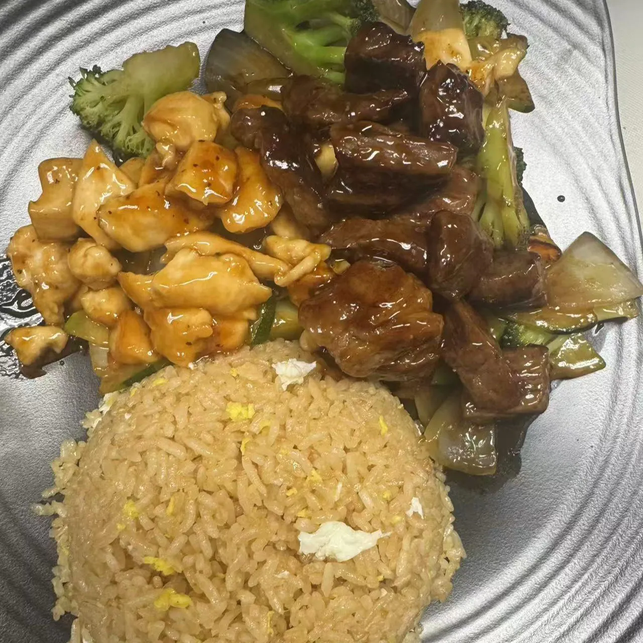 Hibachi combo plate with chicken, steak stir fry, mixed veggies and egg fried rice at 100 Boil Pot & Grill, a Chinese Restaurant in Tucson